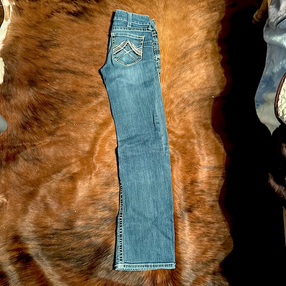 Airat boot cut women’s denim jeans, size 26L, color is a light wash.